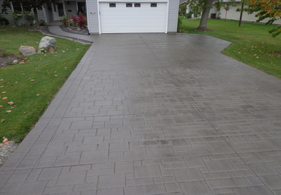 Stamped and stained brown concrete made to look like pavers.