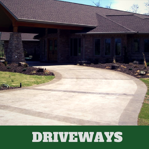 Two toned colored concrete driveway in Roanoke, VA with brick home.