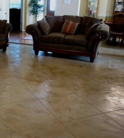 Stamped and stained concrete squares in living room floor.