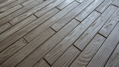 Wood grain plank style stamped interior floor.