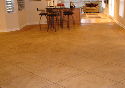 Stained and textured floor made to look like tiles all throughout main level of home in Roanoke, Virginia.
