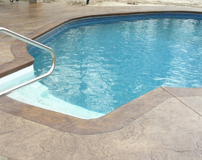 Textured and stained concrete pool deck.