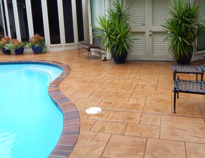 Stamped, stained and polished concrete pool deck.