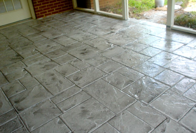 Indoor patio stamped gray concrete.