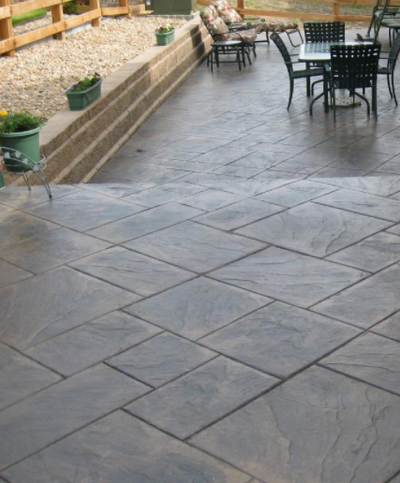 Stamped concrete patio, with gray and brown stain in Virginia.