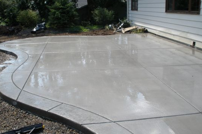Polished concrete back patio, with stamped concrete edging.