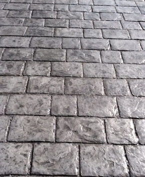 Gray stamped concrete, made to look like real brick.